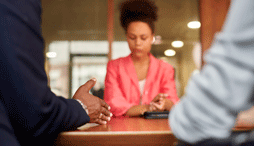 An employee and two supervisors during an employee disciplinary meeting