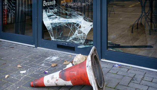 a broken storefront window