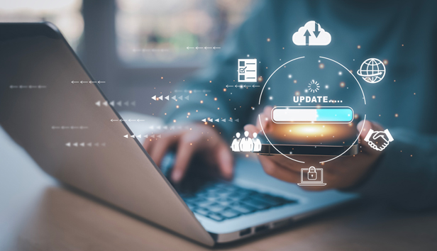 A website updating on a laptop and cell phone